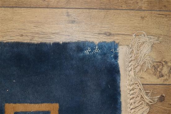 A Chinese blue ground carpet with Greek key border 480 x 365cm